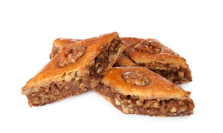 Photo of Delicious honey baklava with walnuts on white background