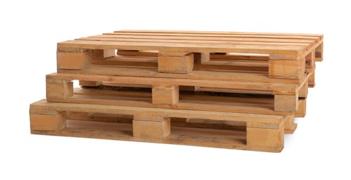 Stacked wooden pallets isolated on white. Transportation and storage