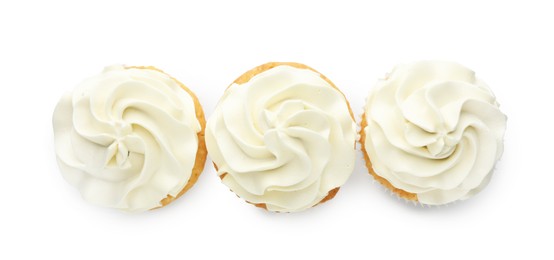 Photo of Tasty vanilla cupcakes with cream isolated on white, top view