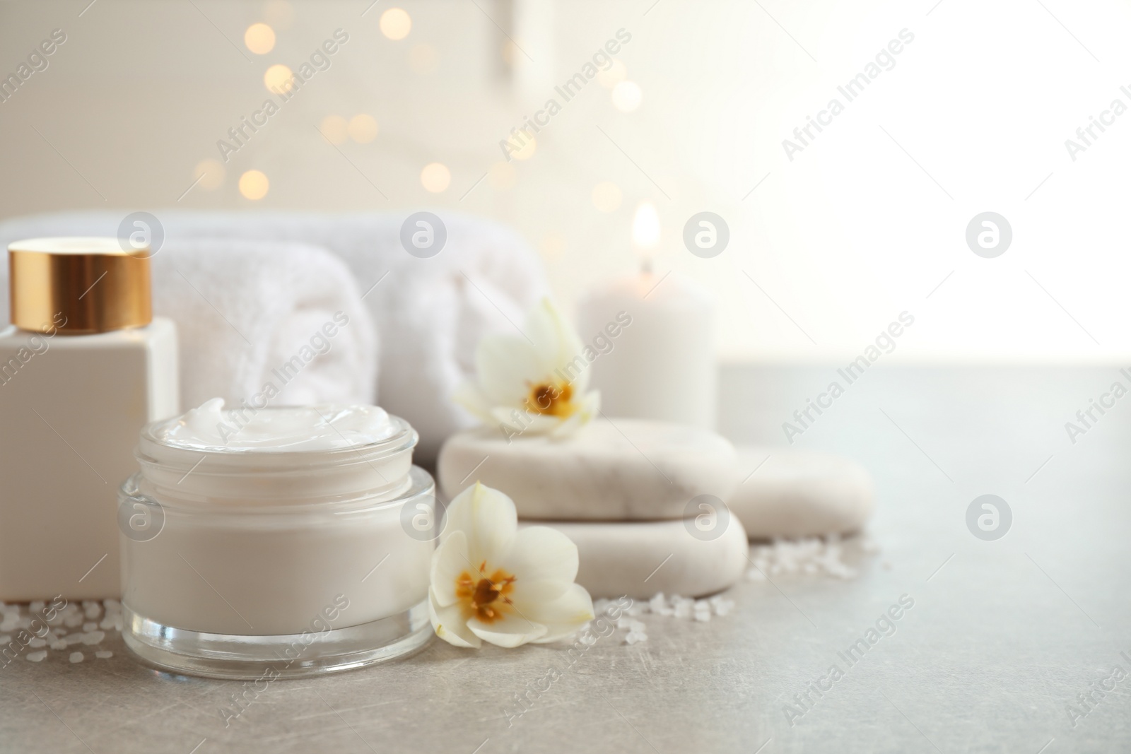 Photo of Spa composition with skin care products on light background, space for text