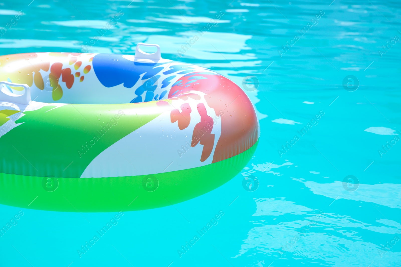 Photo of Inflatable ring in swimming pool on sunny day