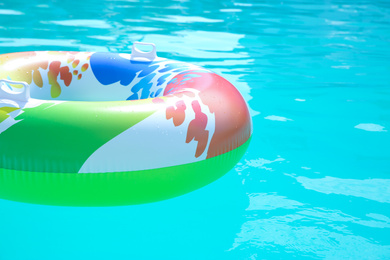 Photo of Inflatable ring in swimming pool on sunny day