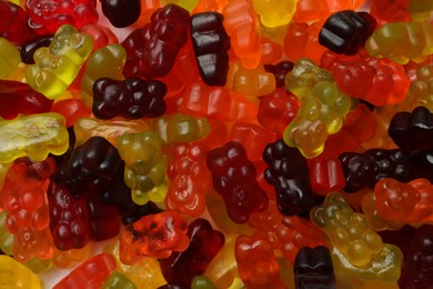 Photo of Delicious gummy bear candies as background, closeup