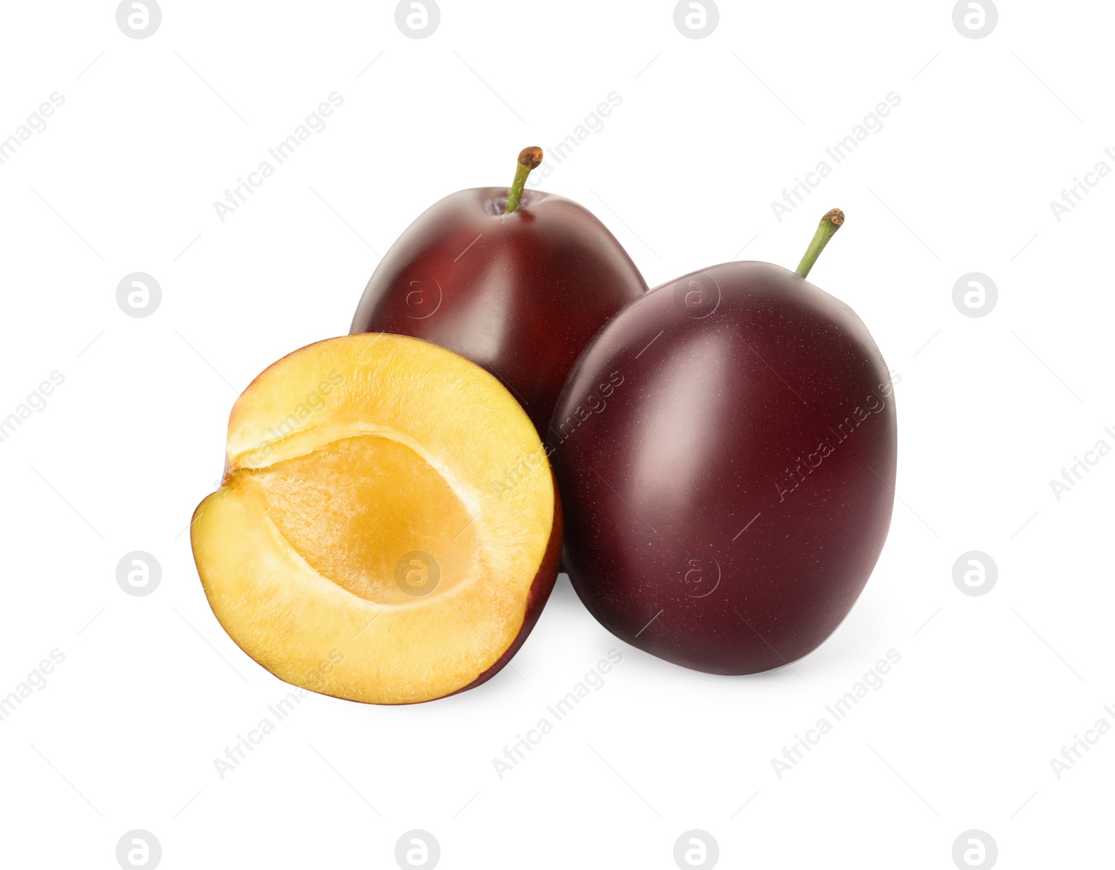 Photo of Whole and cut ripe plums on white background