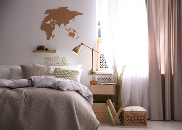 Photo of Modern eco style interior with wooden crates and comfortable bed