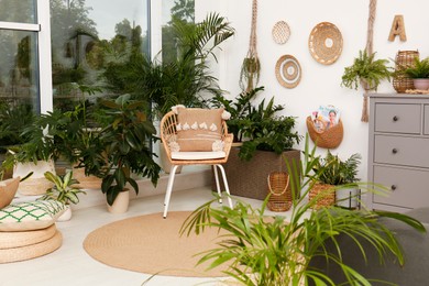 Photo of Room interior with stylish furniture and green plants