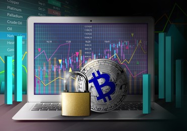 Digital currency security. Bitcoin and padlock on laptop. Charts, data and graphs