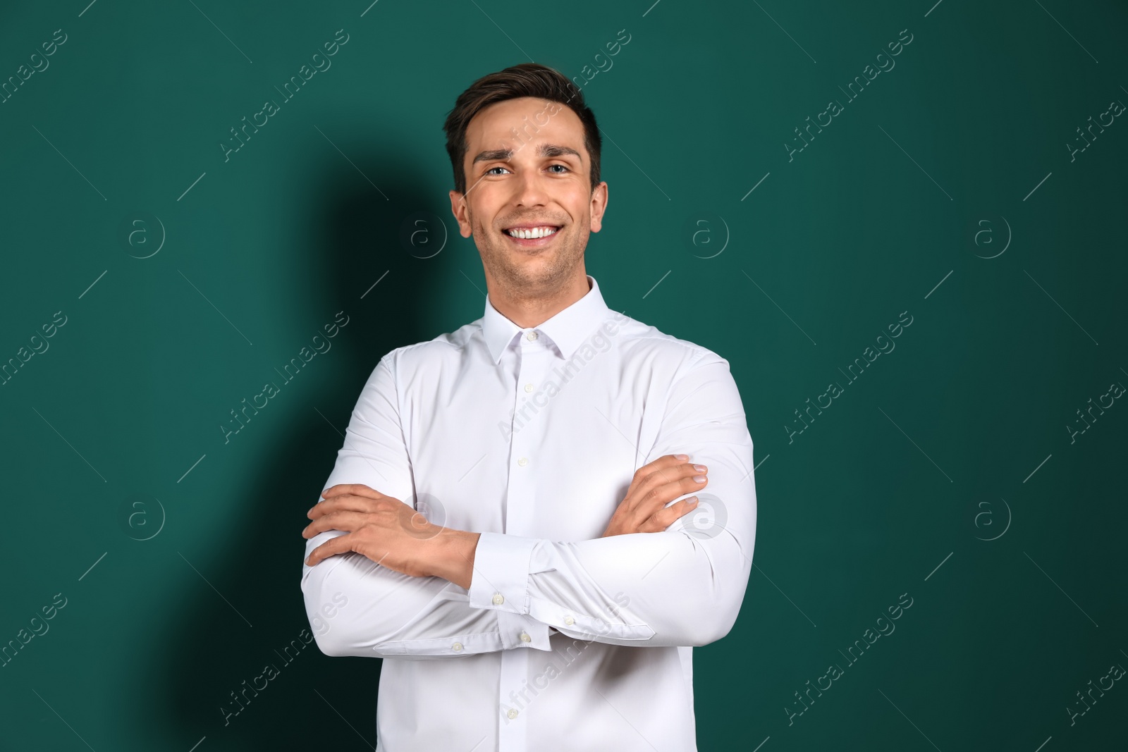 Photo of Portrait of male teacher on color background. Space for text