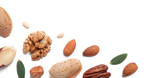 Different delicious nuts on white background, flat lay. Space for text