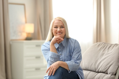 Photo of Portrait of happy mature woman at home