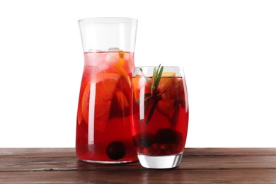 Delicious sangria on wooden table against white background