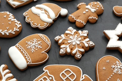 Photo of Many different delicious Christmas cookies on black table