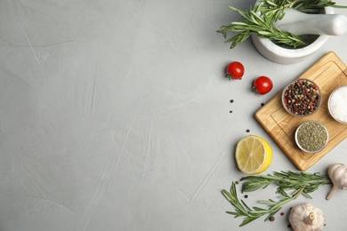 Photo of Flat lay composition with ingredients for cooking on grey table. Space for text