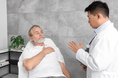 Photo of Senior patient having appointment with doctor in clinic