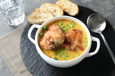 Photo of Tasty cooked rabbit meat with sauce served on table, above view