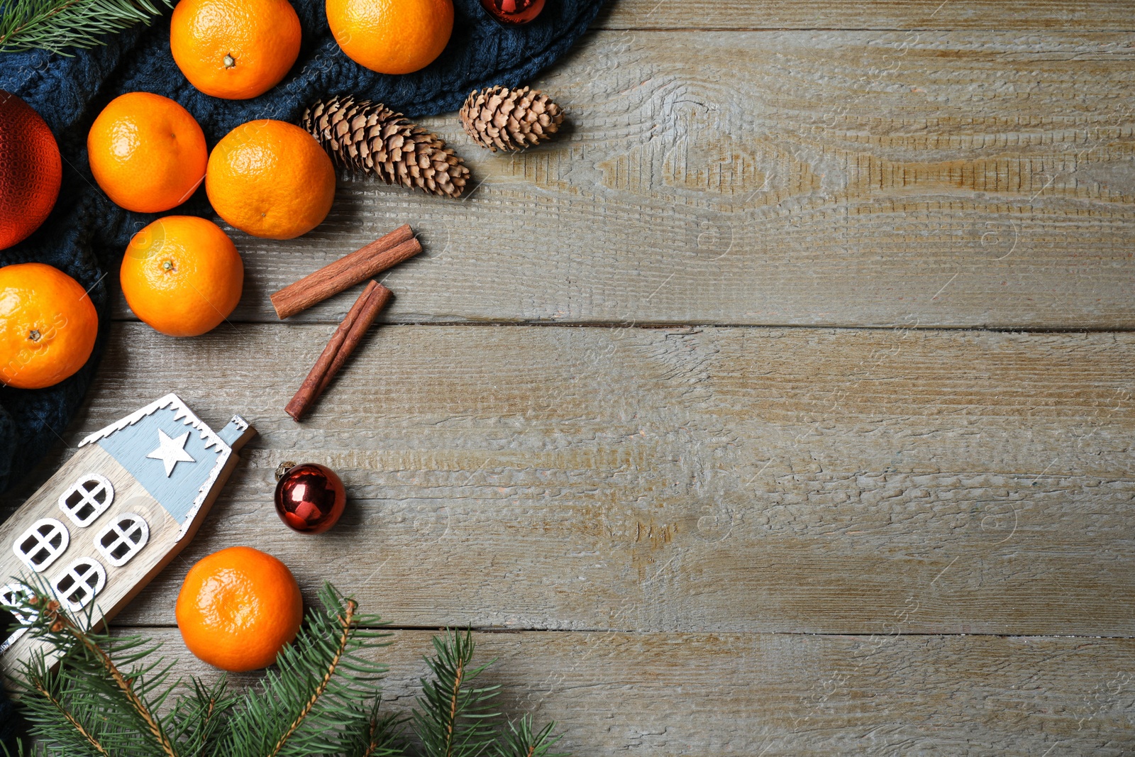 Photo of Flat lay composition with tangerines on wooden background. Space for text