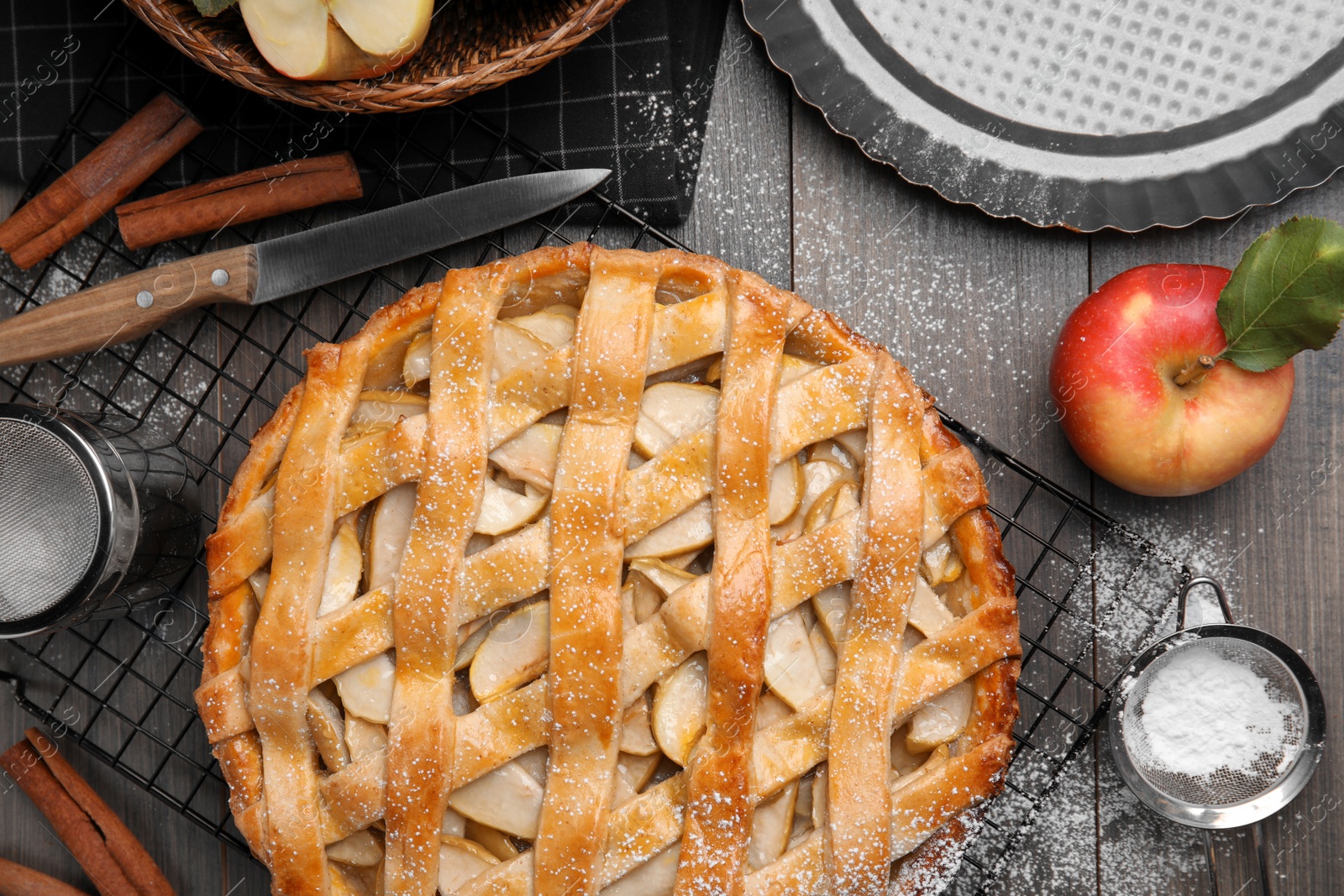Photo of Delicious traditional apple pie on table, flat lay
