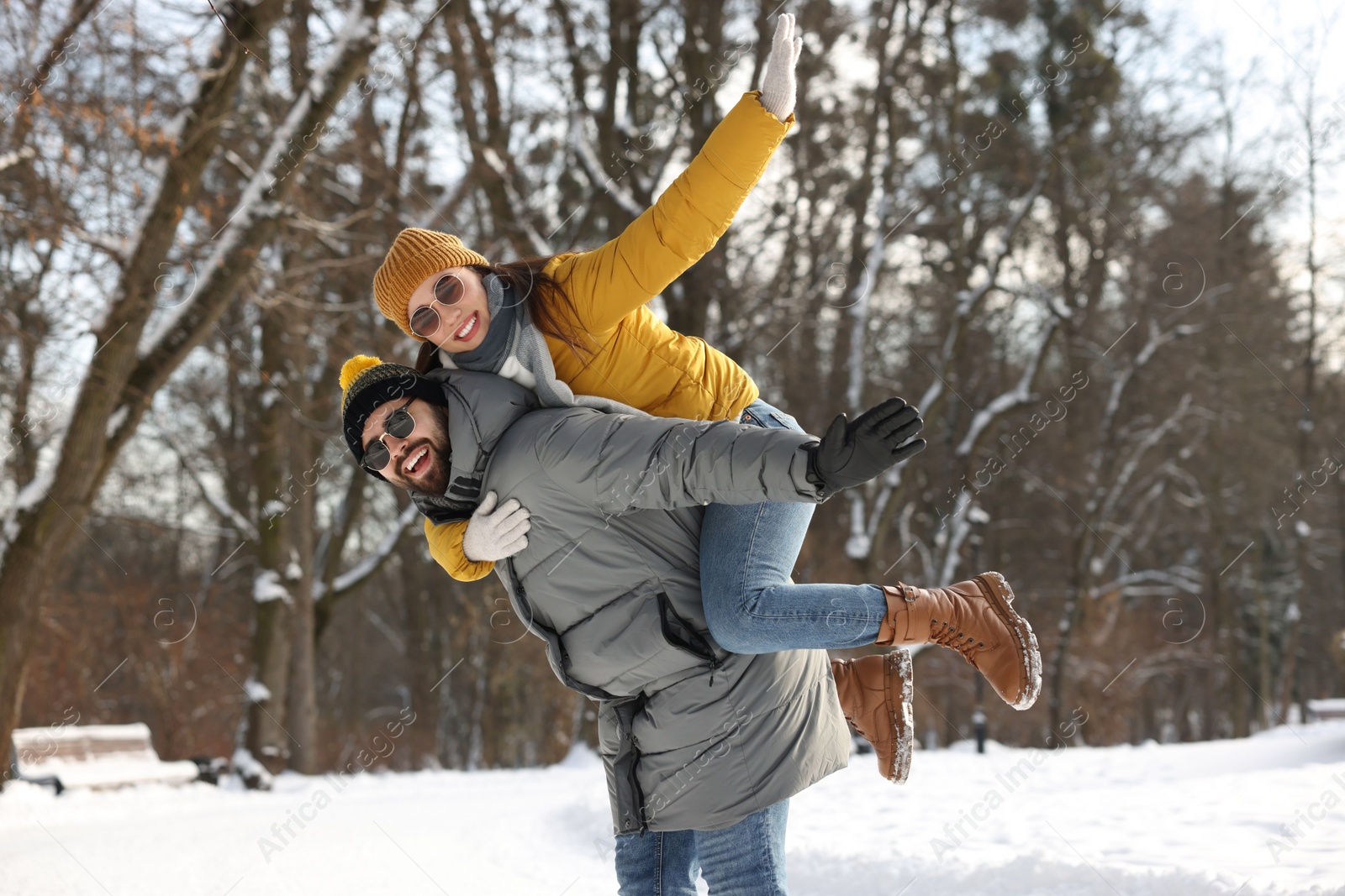 Photo of Happy young couple having fun outdoors on winter day