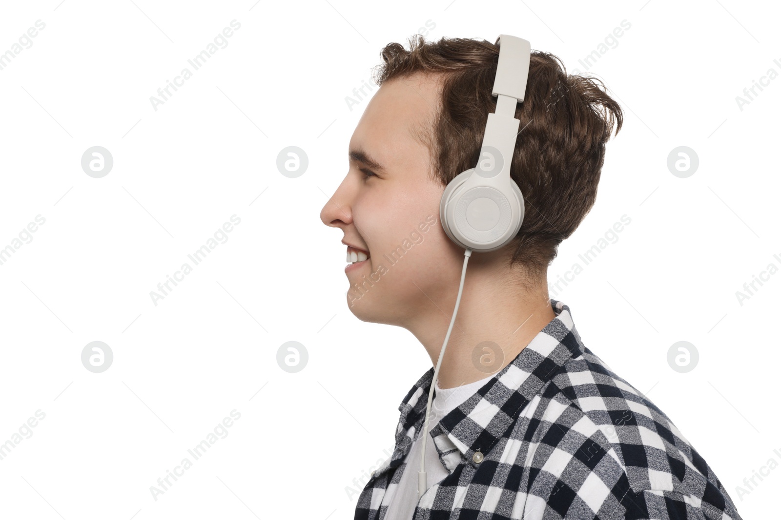 Photo of Handsome young man with headphones on white background