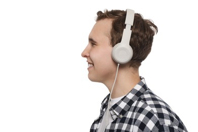Photo of Handsome young man with headphones on white background