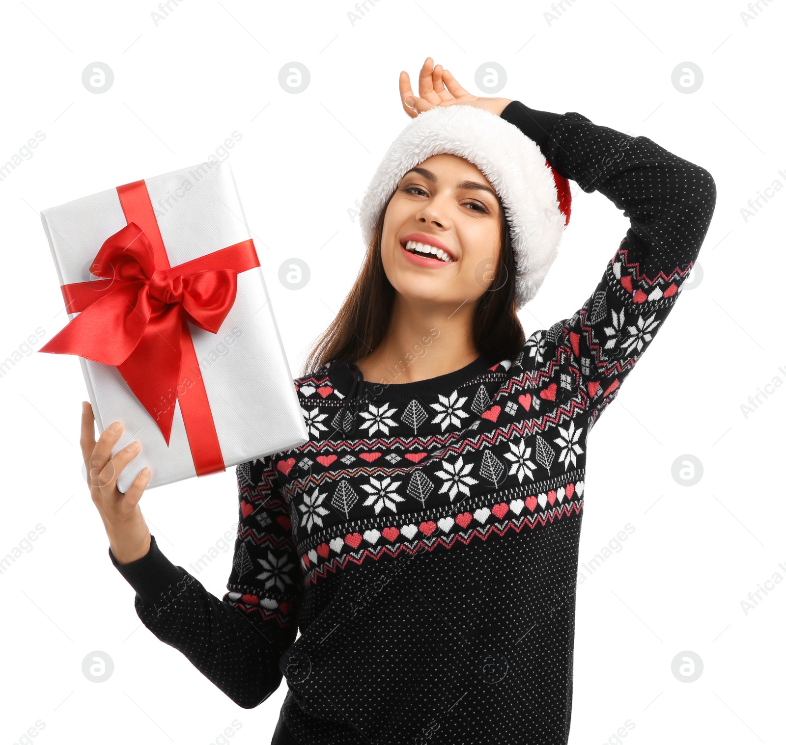 Photo of Young beautiful woman in Santa hat with gift box on white background. Christmas celebration