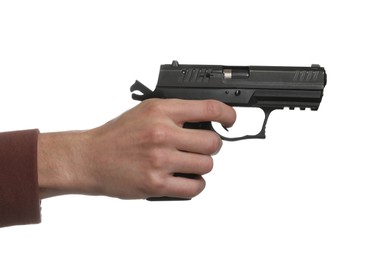 Man aiming gun against white background, closeup