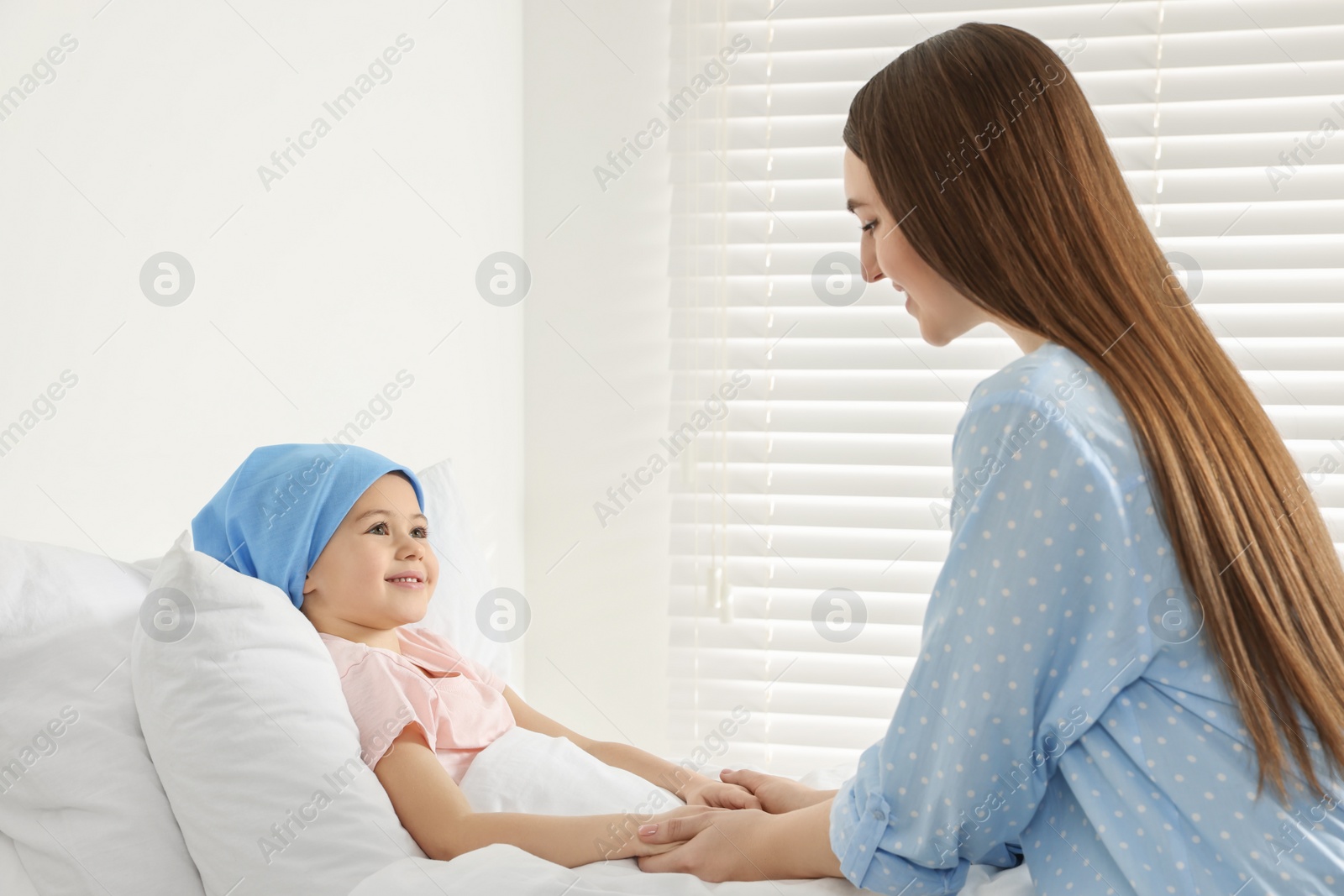 Photo of Childhood cancer. Mother and daughter in hospital