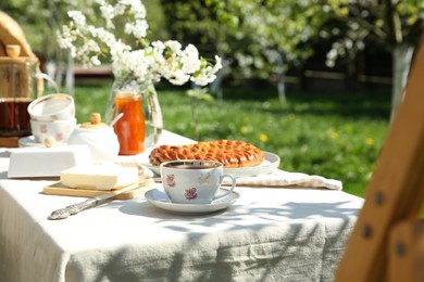 Photo of Beautiful table setting in spring garden on sunny day