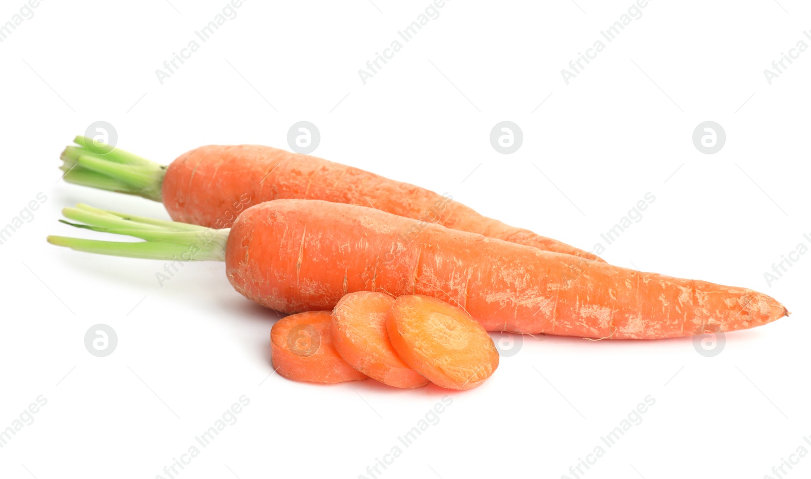 Photo of Whole and sliced ripe carrots on white background