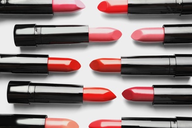 Photo of Flat lay composition with lipsticks on white background