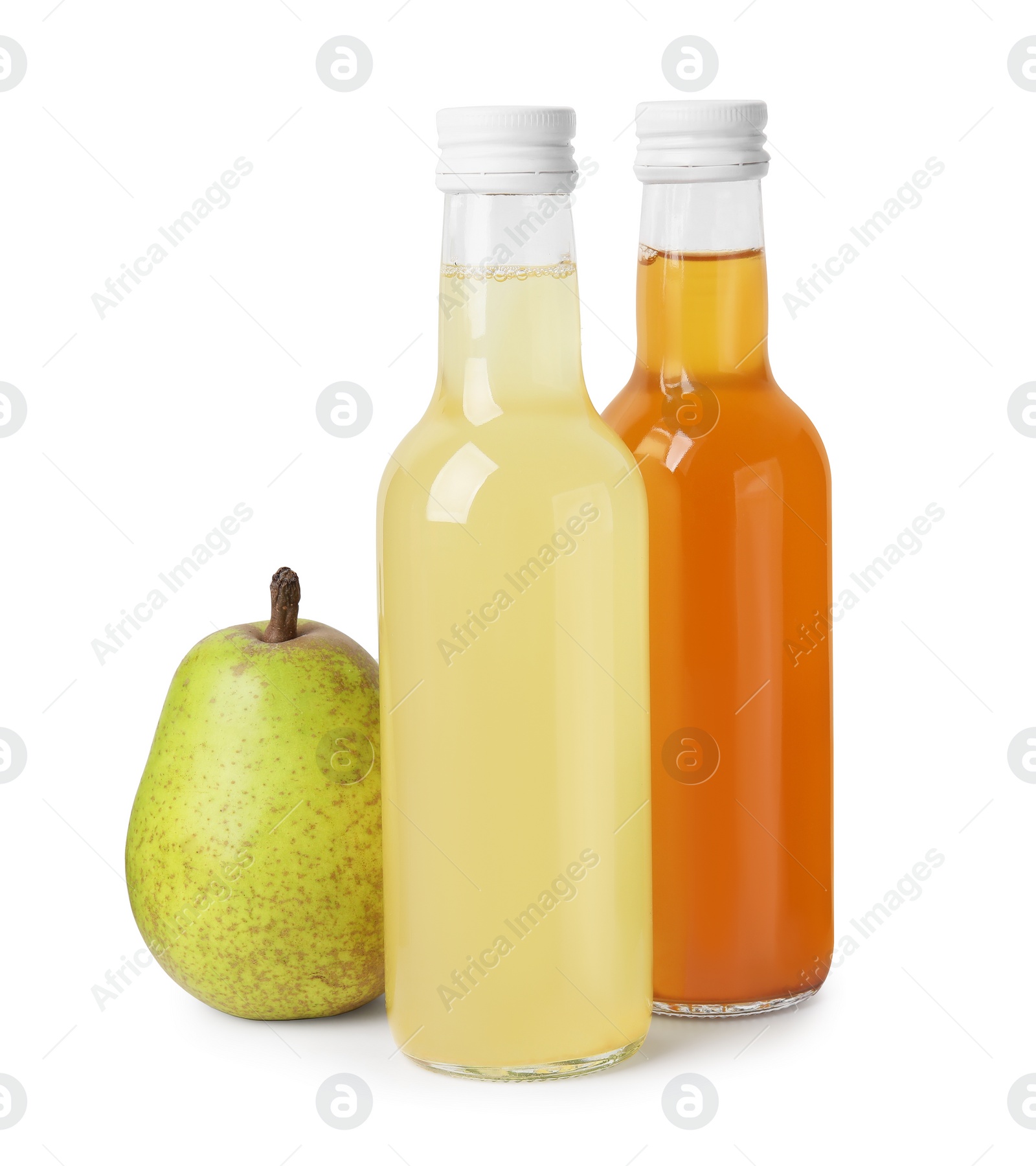 Photo of Delicious kombucha in glass bottles and pear isolated on white