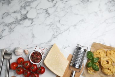 Photo of Flat lay composition with cooking utensils and fresh ingredients on white marble table. Space for text