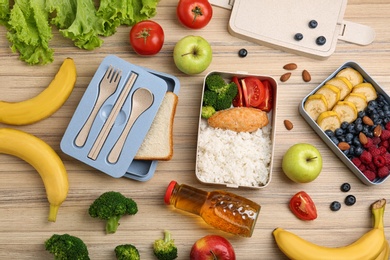 Flat lay composition with healthy food  on wooden table. School lunch