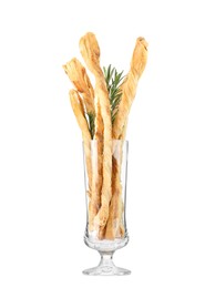 Photo of Delicious grissini and rosemary in glass on white background