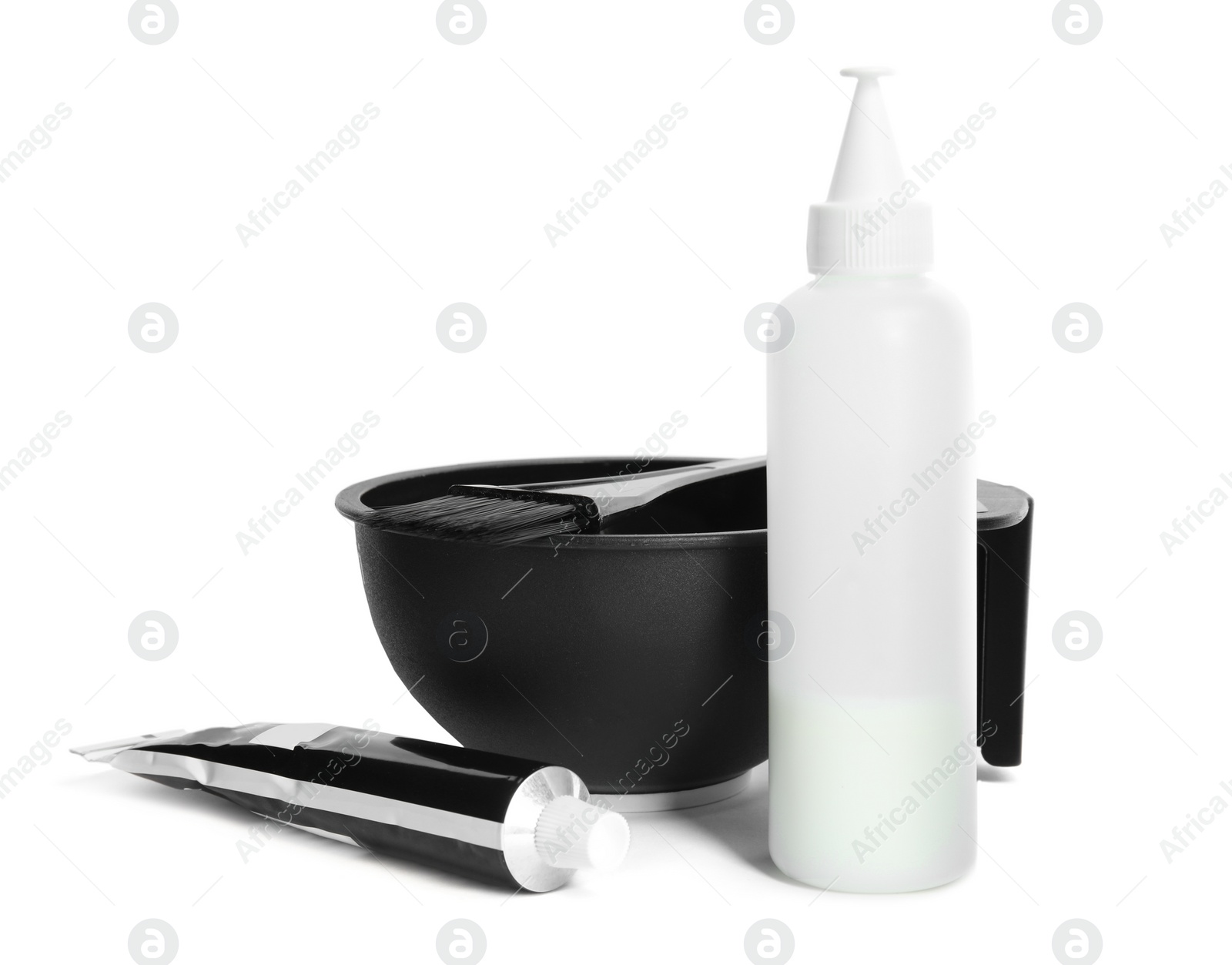 Photo of Professional tools for hair dyeing on white background