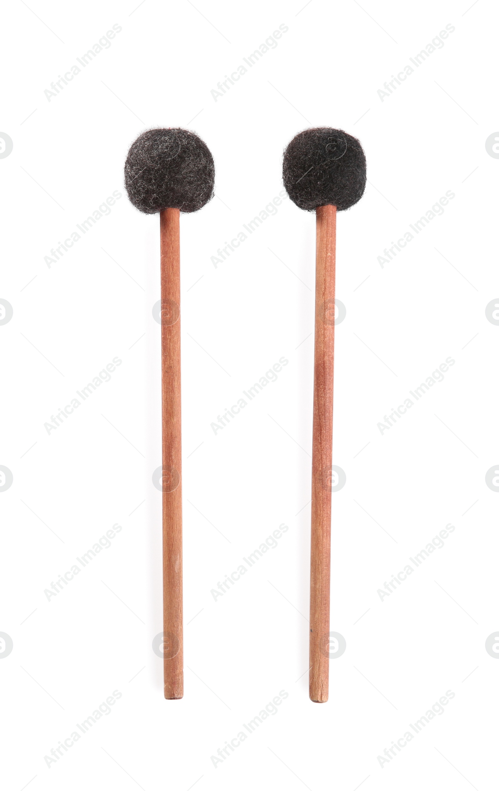 Photo of Wooden bass drumsticks on white background, top view