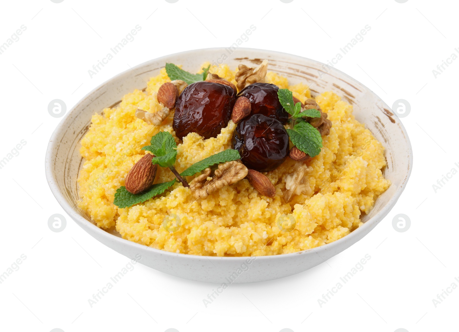 Photo of Tasty cornmeal with dates, nuts and mint in bowl isolated on white