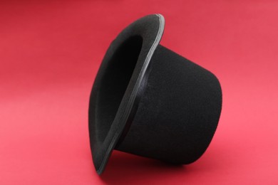 One magician top hat on red background