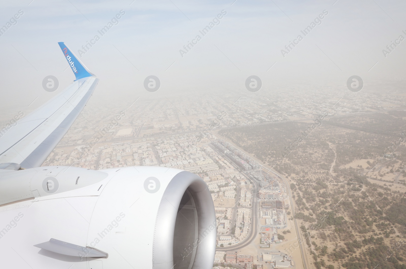 Photo of DUBAI, UNITED ARAB EMIRATES - NOVEMBER 06, 2018: Panoramic view of city from Flydubai plane