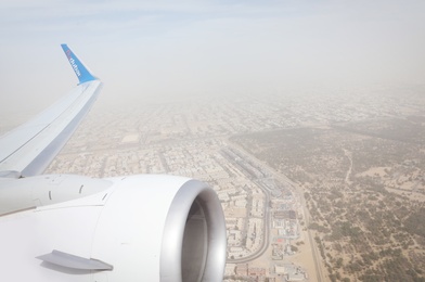 DUBAI, UNITED ARAB EMIRATES - NOVEMBER 06, 2018: Panoramic view of city from Flydubai plane