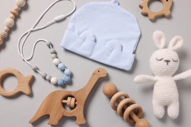 Photo of Different baby accessories on grey background, flat lay