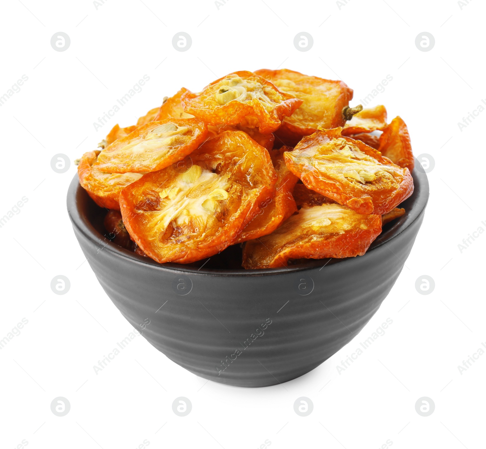 Photo of Bowl of cut dried kumquat fruits isolated on white