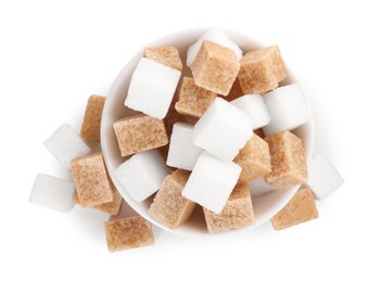 Photo of Different types of sugar in bowl isolated on white, top view