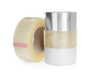 Many different rolls of adhesive tape on white background