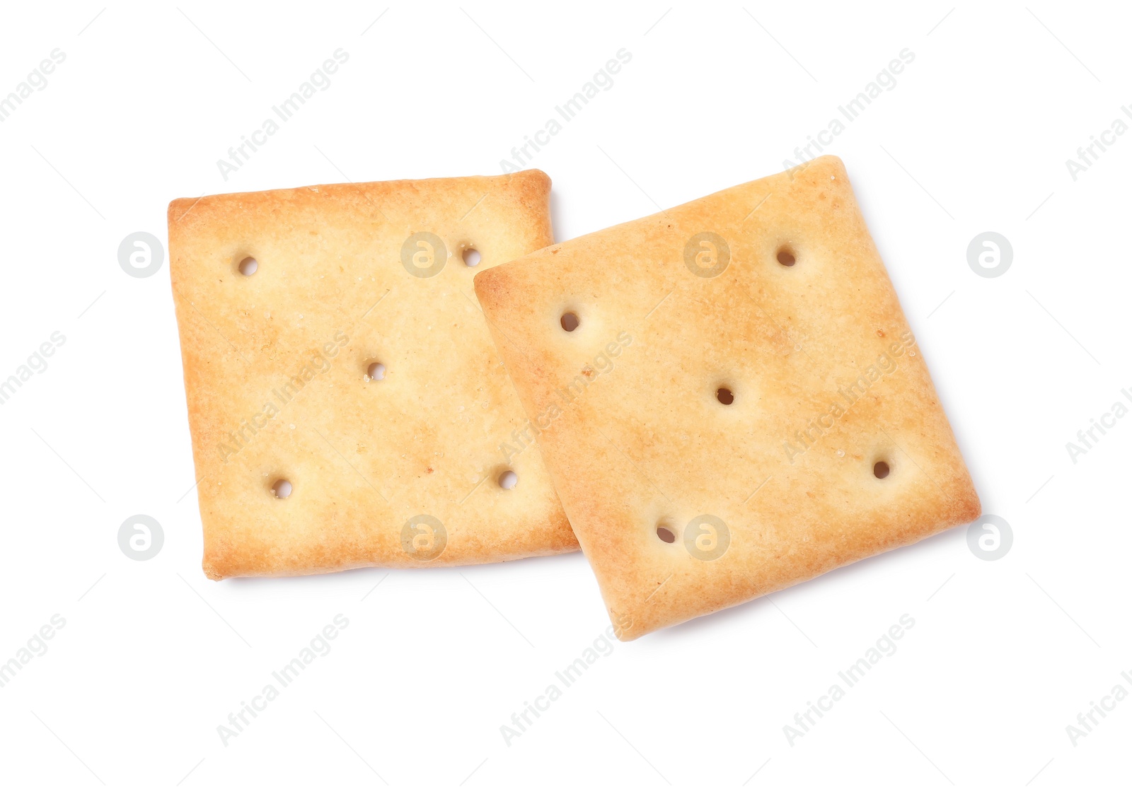 Photo of Two crispy crackers isolated on white, top view. Delicious snack