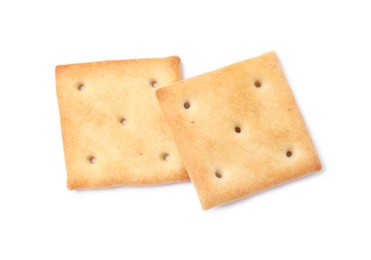 Two crispy crackers isolated on white, top view. Delicious snack