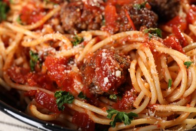 Photo of Delicious pasta with meatballs and tomato sauce as background, closeup