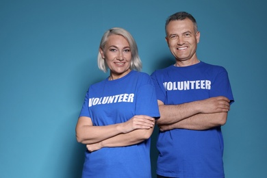 Photo of Portrait of volunteers in uniform on blue background