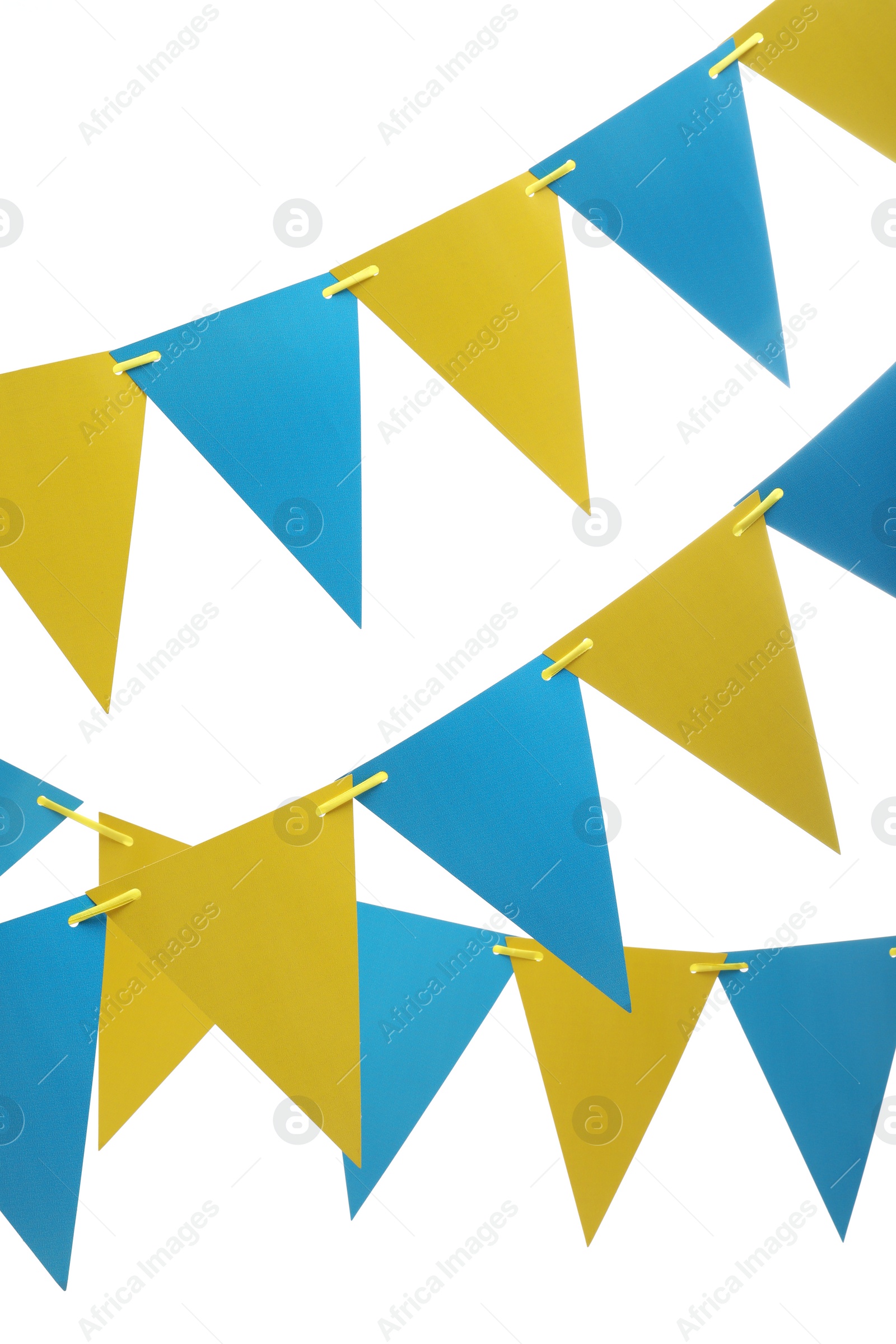 Photo of Rows of triangular bunting flags on white background. Festive decor