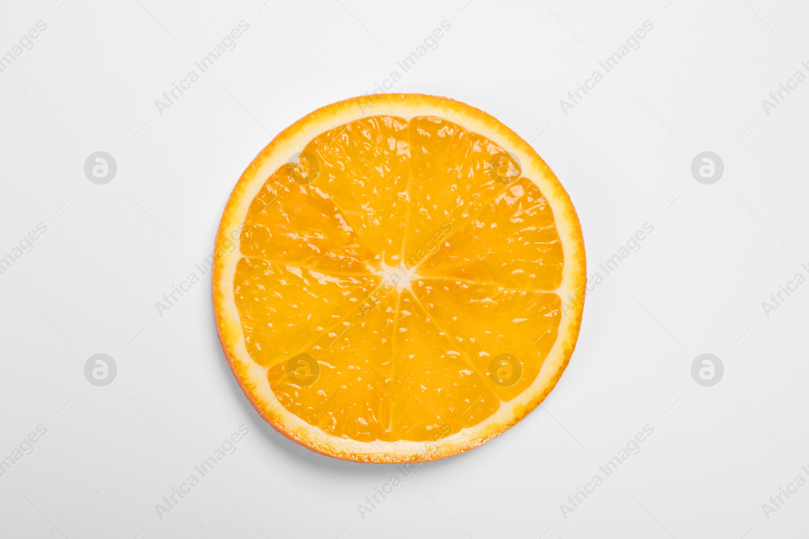 Photo of Slice of juicy orange on white background, top view
